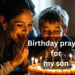 Mother praying with son over birthday cake with candles
