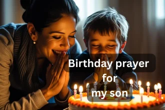 Mother praying with son over birthday cake with candles