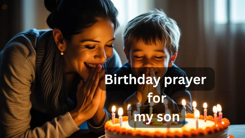 Mother praying with son over birthday cake with candles