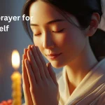 Woman praying on birthday with candles representing birthday prayer for myself
