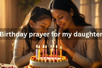Mother and daughter praying together on birthday with candles and cake